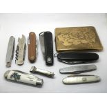 A collection of penknives and oddments.