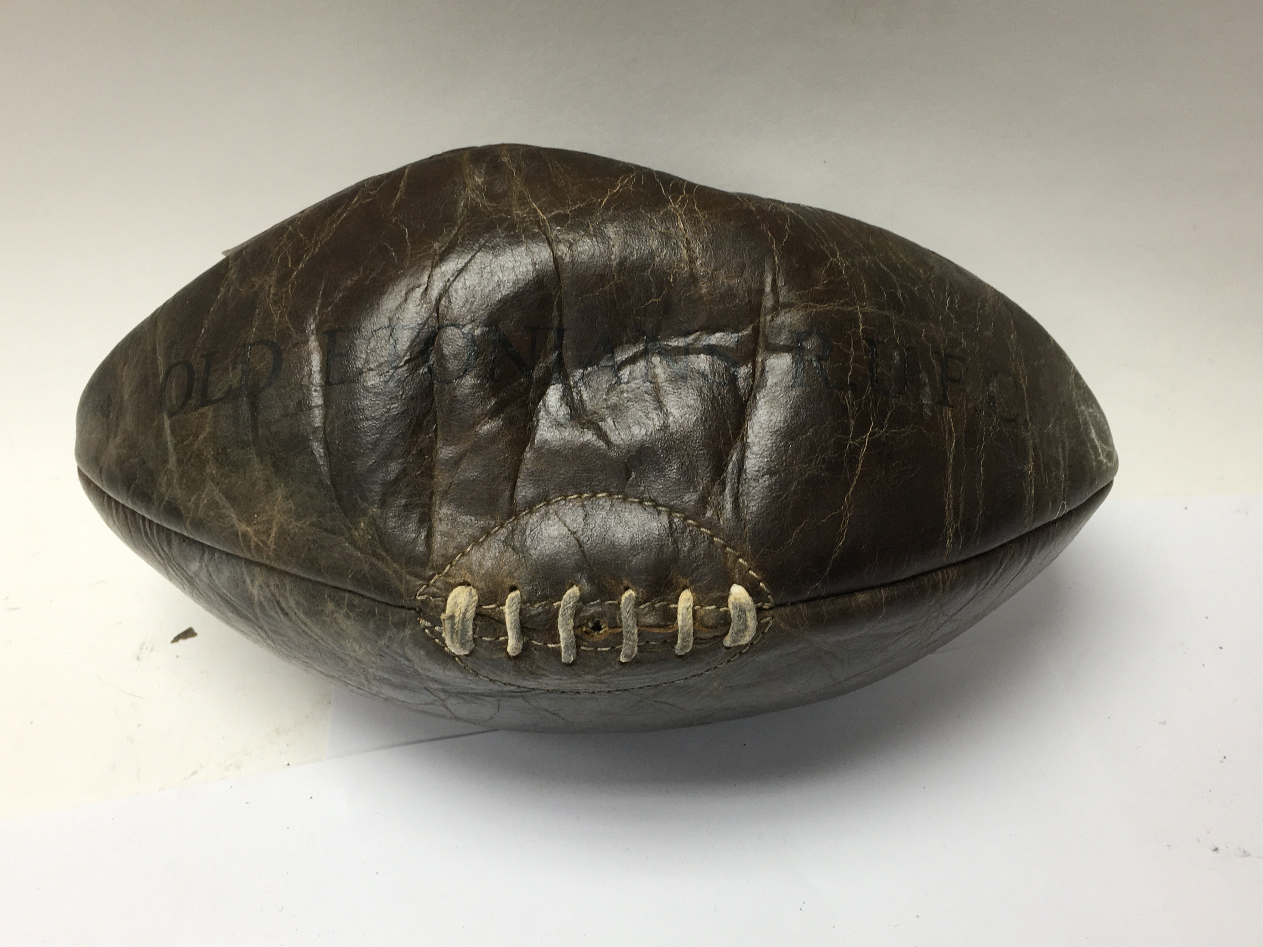 A 1930s Vintage leather rugby ball for Old Etonian