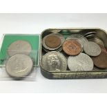 A tin of various coinage.