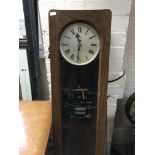 A oak case Synchronme electric slave clock .