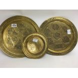 A pair of eastern copper and silver inlaid trays a