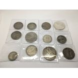 A collection of 12 GB and American coins.