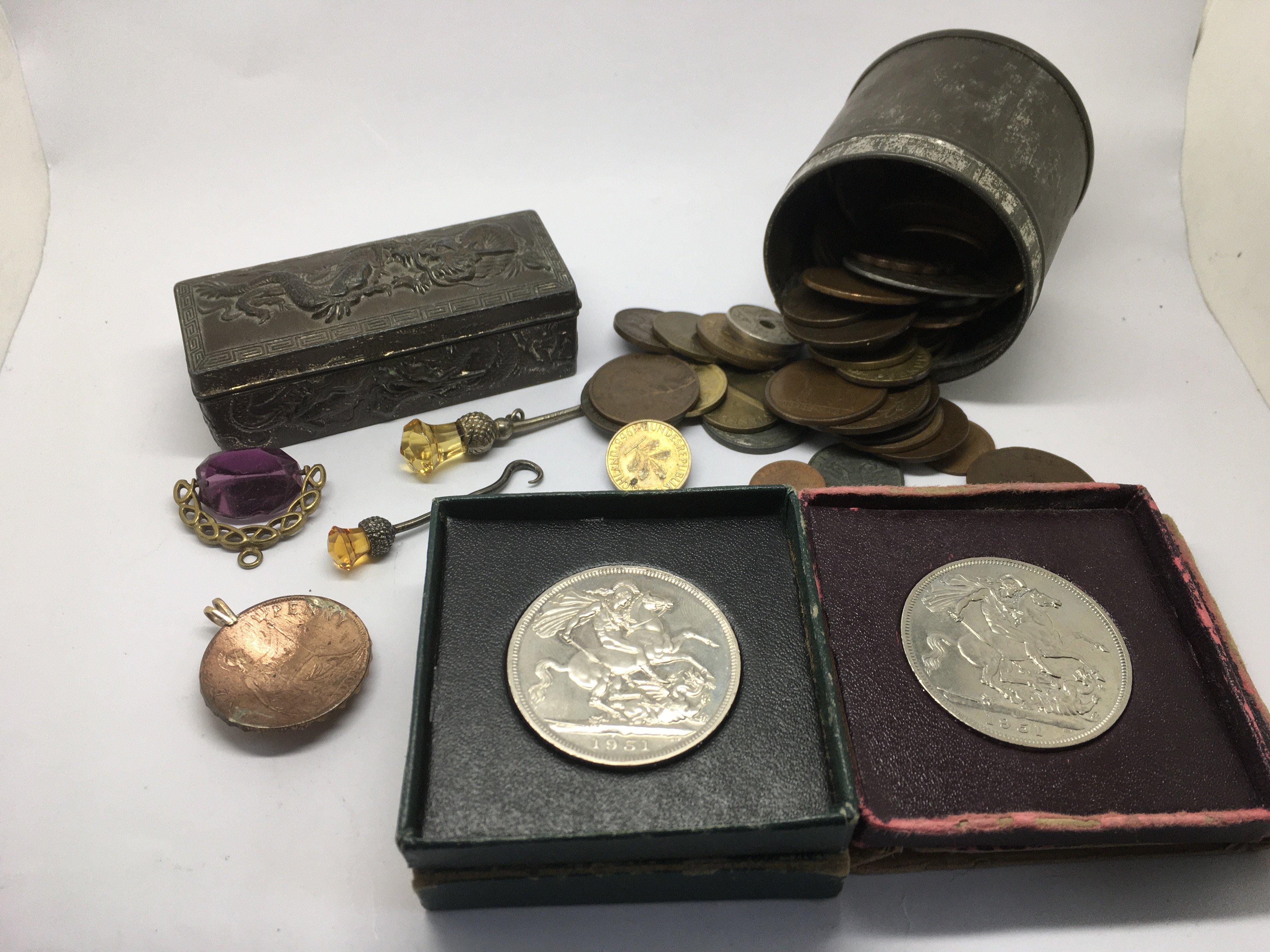 A small Chinese box, various coins, pens and other