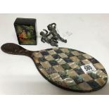 A tortoiseshell hand mirror inlaid with mother of