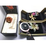 A boxed stickpin in the form of a rose, a handmade