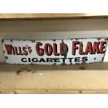 A long vintage enamel sign for Willâ€™s Gold Flake