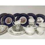 A set of six porcelain ribbon plates decorated wit