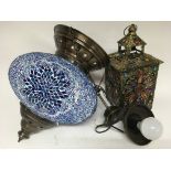 A large circular blue Moorish style ceiling light