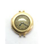 A small gold watch, not working.