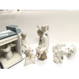 A collection of Lladro figures three polar bears an angle with a flute boxed and four others (one