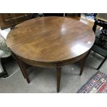 A Georgian mahogany D end dining table with additi