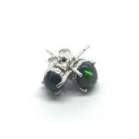 A pair of silver studs set with black Ethiopian op