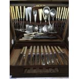 An oak canteen of cutlery plus two other cased set