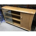 A modern design light oak display or bookcase cabi