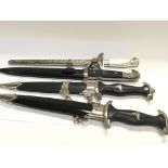 Four replica German Third Reich daggers SS and oth