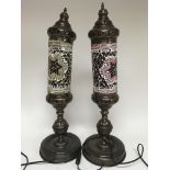 Two Moorish style lamps of tall cylindrical design