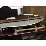 A hand made model motor boat ( in need of attention). 129cm.