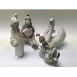 4 Lladro porcelain figurines.