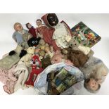 A box containing various dolls, teddy bears and vi
