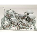 A porcelain Cabernet tea set including tea pot, cu