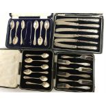Four boxes of cutlery including silver handled kni