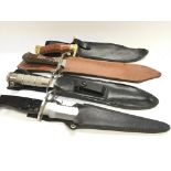 Four hunting knifes one with ornate brass mounts (