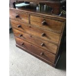 A mahogany chest of drawers fitted with two short