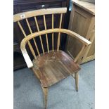 A Ercol style stick back open arm chair the solid