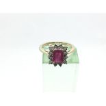 A 9ct gold rectangular ruby and diamond cluster ri