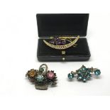 A Victorian crescent shaped brooch set with seed p