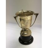 A three handled silver trophy cup Birmingham hallm
