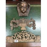 A carved cherub wall sconce and 2 additional carved wooden panels