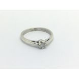 A White gold ring set with a solitaire diamond rin