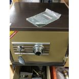 A Phoenix safe with combination lock and key and b