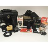 A collection of cameras, lenses and other photogra