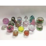 A collection of various paperweights.