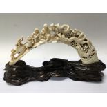 A Japanese ivory carving in the form of a dragon f