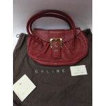 A red leather Celine hand bag, complete with origi