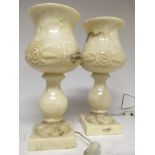 A pair of Onyx lamps decorated with flowers a foli