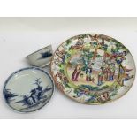 A Canton plate decorated with figures in landscape view and a Nanking Cargo tea bowl and saucer