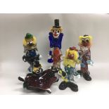 Five Murano glass clowns.