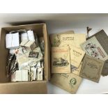 a box of cigarette cards loose and in albums