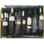 A large case of various bottles of red wine.
