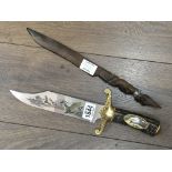 Two knives, one with simulated Stag handle. The ot