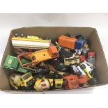 A collection of playworn die cast vehicles.