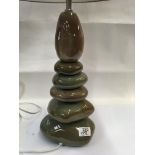 A modern ceramic pebble style lamp.