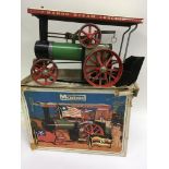 A boxed Mamod steam tractor in original box .