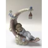 A Lladro figure titled 'heavenly slumber', figure