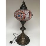 A standard lamp in the Moorish style with 7 gradua