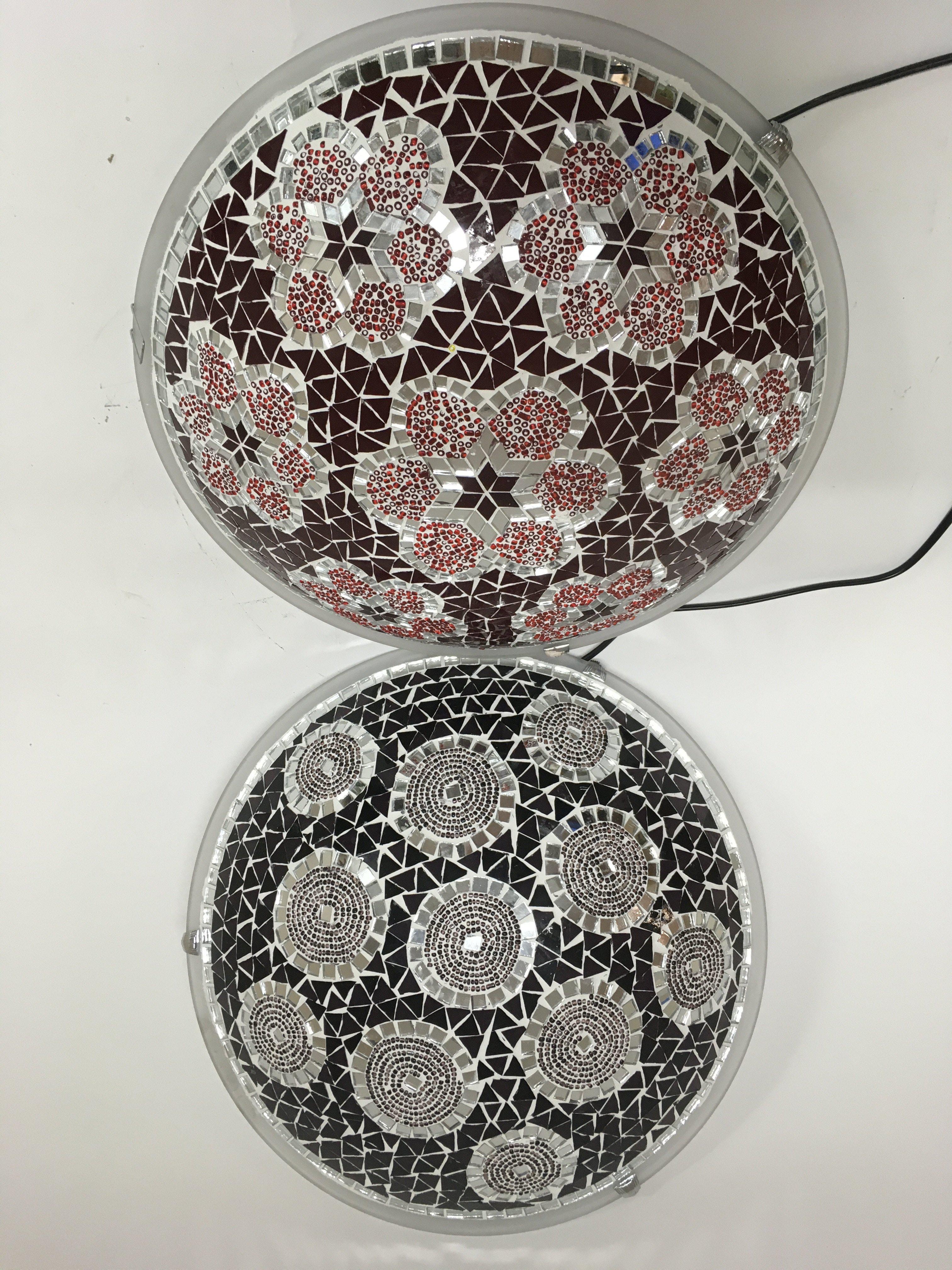 Two circular ceiling lights in the Moorish style.